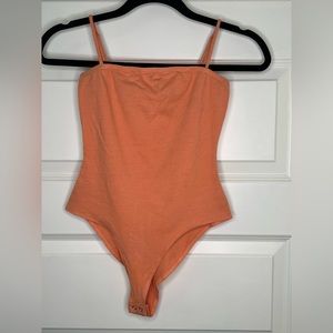 Charlotte Russe Orange One Piece size XS.